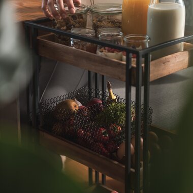 A breakfast trolley with fruit, cereal, juice, and various cold cuts | © Karin Pasterer